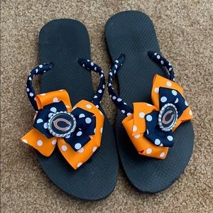 Brand new Silly Lilly Chicago Bear flip flops.